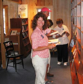 Carole Scott Gartley mobbing at the Owl & Turtle Bookshop (photo; Cash Mob Camden) cash mob, midcoast