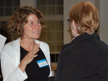 Kim Huisman (left), Associate Professor of Sociology and Coordinator of the Maine Mother-Daughter Project speaks with keynote speaker Lyn Mikel Brown. (Photo by Kathleen Meil)