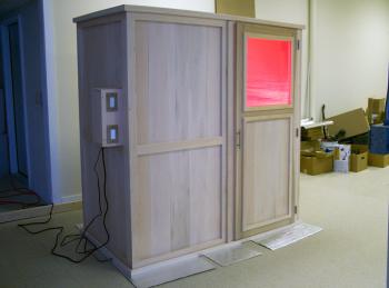 The glow of near infrared bulbs can be seen through the window of Goldstein's newest sauna, which was undergoing some finishing touches at his Searsport workshop. (Photo by Ethan Andrews)