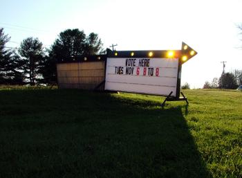With small populations and hand-counted ballots, small towns like Knox, pictured here, were able to submit final election tallies on Election Night. But in Belfast, multiple polling places, a larger population and a voting machine hitch conspired to delay final results for days. (Photo by Ethan Andrews) "Vote Here" sign, Town of Knox
