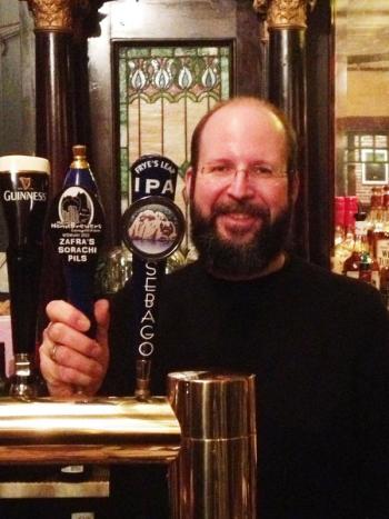 Whitcomb gets to pour his own beer from Darby's tap. (photo: Charlie Dufour). Darby's Restaurant