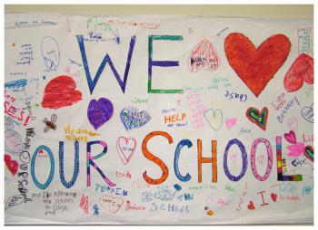 A poster on the wall of the Stockton Spring Elementary School cafeteria where Tuesday nights' school board meeting was held. The school is being considered for closure or reorganization. (Photo by Ethan Andrews)