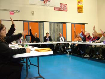 The RSU 20 board votes in the new teachers' contract on Tuesday night after four years of negotiation. The contract, which unifies the salaries of former SAD 34 and 56 teachers and staff is for the years 2012-2014. (Photo by Ethan Andrews)