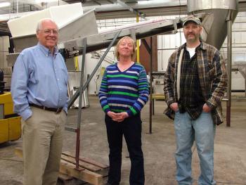 The Coastal Farms and Food Processing management team, from left, Wayne Snyder, Jan Anderson and Tony Kelly in a portion of the company's 60,000 facility that was used last fall to process over a million pounds of frozen blueberries. (Photo by Ethan Andrews)