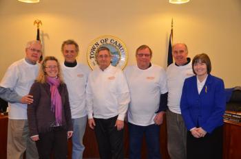 Camden Select Board members Don White, Leonard Lookner, Martin Cates, John French and Jim Heard pose with Toboggan Committee Chairman Holly Edwards, left, and Town Manager Patricia Finnigan. (Photo by Lynda Clancy)