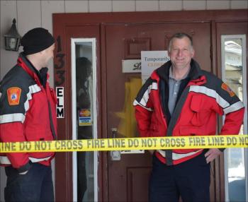 Cheyne Hansen, Camden firefighter and Fire Chief Chris Farley stand outside what once was Lotus Restaurant. (Photo by Lynda Clancy)