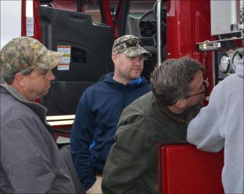 Lincolnville Fire Chief Jason Peasley, center, is Rockport's new fire chief, starting May 20. In this photo, Peasley and members of the Lincolnville Fire Department inspect a new truck that arrived in that town in November 2012. (Photo by Lynda Clancy)