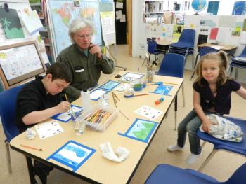Max Van Dyne with Maury Colton and Skylar Dupuie at Matinicus Elementary School. (Photo by Eva Murray)