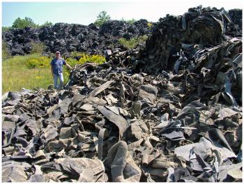 A portion of the largest piles of scrap fiber material on the former shooting range. (Photo by Ethan Andrews)