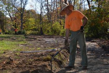 Geoff Scott, of Camden, volunteers Saturday, Oct. 19, at the Riverwalk site. Scott has been the leading visionary of the Riverwalk for several years, helping to secure a $15,000 grant for its construction alongside the Megunticook River on the old Apollo Tannery site on Washington Street. (Photo by Lynda Clancy)