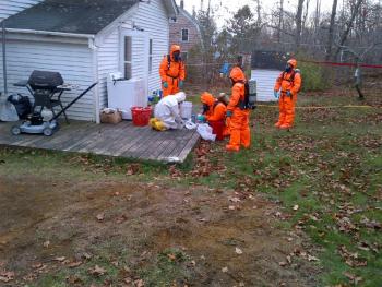State crime lab members at a suspected methamphetamine lab-related scene located at a South Shore Drive residence in Owls Head. Members are processing the crime scene for evidence of the drug's manufacture. (Courtesy MDEA) MDEA meth drugs warrant owls head
