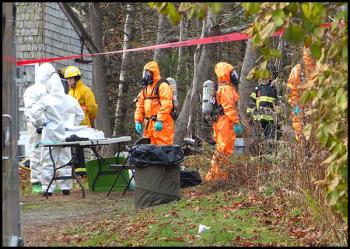 MDEA agents and members of the state DEP’s oil and hazardous material response team at the scene of an alleged methamphetamine laboratory on South Shore Drive in Owls Head. (Photo by Chris Wolf)
