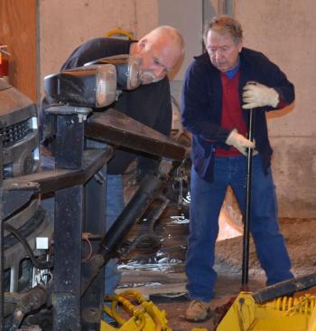 Rockport Public Works longtime employee James Aldus and Steve Beveridge tend to repairs at the town garage. (Photo by Lynda Clancy)