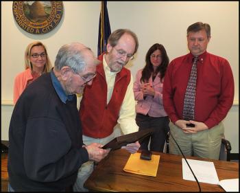 Raymond Athearn receives a plaque and certificate from Rockland Mayor Larry Pritchett. (Photo by Chris Wolf)