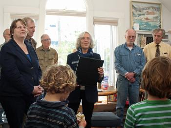 Rep. Joan Welsh (D-Rockport) reads a Maine 126th Legislature proclamation recognizing the Rockport Public Library’s 100th anniversary May 30. (Photo by Holly S. Edwards)