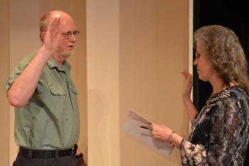 Linda Greenlaw, Rockport Town Clerk, gives the oath of office to reelected Select Board Chairman Bill Chapman. (Photo by Lynda Clancy)