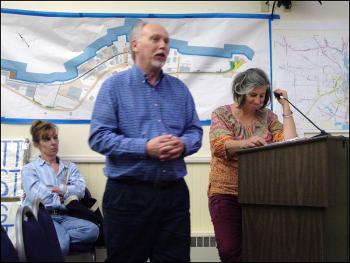Belfast City Planner Wayne Marshall, center, answers a question posed by a City Council member about current zoning on Seaview Terrace. Behind him, residents of the street, Kathleen Kearns, right, and Laurie Allen wait to address the Council. (Photo by Ethan Andrews)