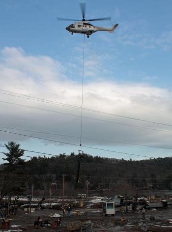 Up in the air, with power lines at the edge of the parking lot to clear. (Photo by Holly S. Edwards)