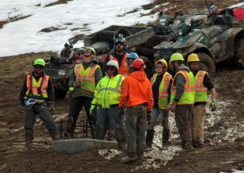 The crew on the mountain waits and watches for the next tower to arrive, via helicopter. (Photo by Holly S. Edwards)