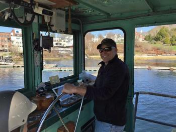Camden Harbormaster Steve Pixley at the wheel of the barge ‘Clam.’ (Courtesy Steve Pixley)