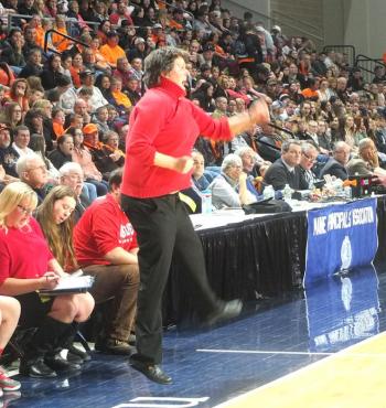 Coach Nelson jumps for joy after a basket.