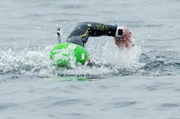 A swimmer makes his way across Penobscot Bay. He and the other swimmers are guided by several course boats, as well as safety boats that included the Coast Guard and Marine Patrol. (Photo courtesy Michele Barker)