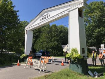 Engineers and contractors determine how to dismantle the iconic arch on Union Street that marks the town line between Camden and Rockport after a delivery truck destroyed one of its posts. (Photo by Lynda Clancy)