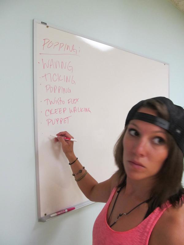 Kea Tesseyman writing down different styles being taught during the workshop. kea tessyman, kinectic energy alive, dance, maine