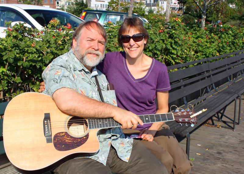 Marta Koonz and her husband, Danny Quinn, on a bench in Camden Harbor Wednesday morning.