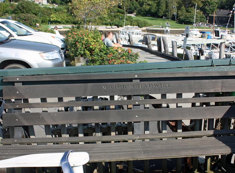 This memorial bench, donated in honor of Major Chadwick by Maine Windjammer Cruises, outside the Camden harbormaster's office is seeking a new annual maintenance sponsor.