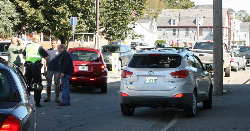 Despite being on vacation, Rockland Deputy Police Chief Wally Tower, far right, was on the scene of the crash on Camden Street Thursday morning.