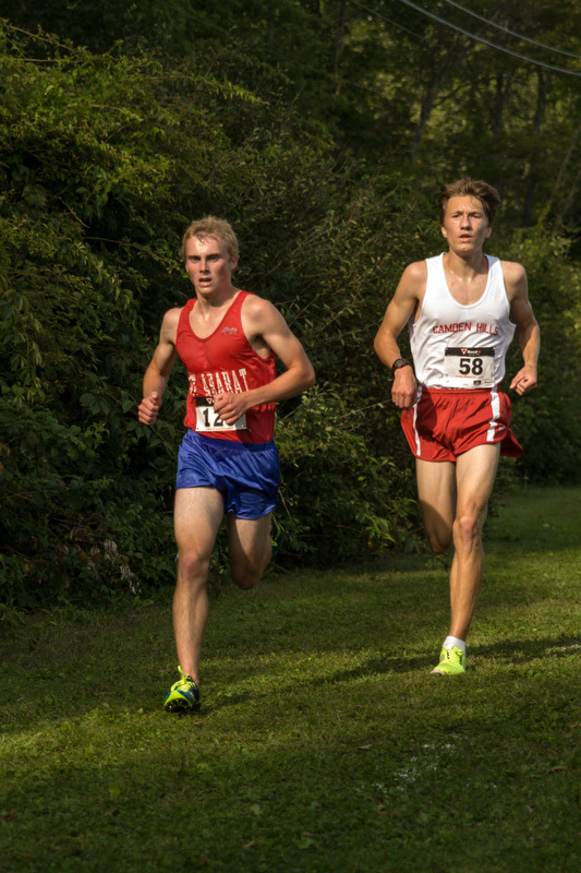 Camden Hills Ben Trapani, right, closes in on Mt. Ararat's Nathan Mackenzie has they approach the finish line. Trapani won the race by less than a second. Photo by Ron Hawkes