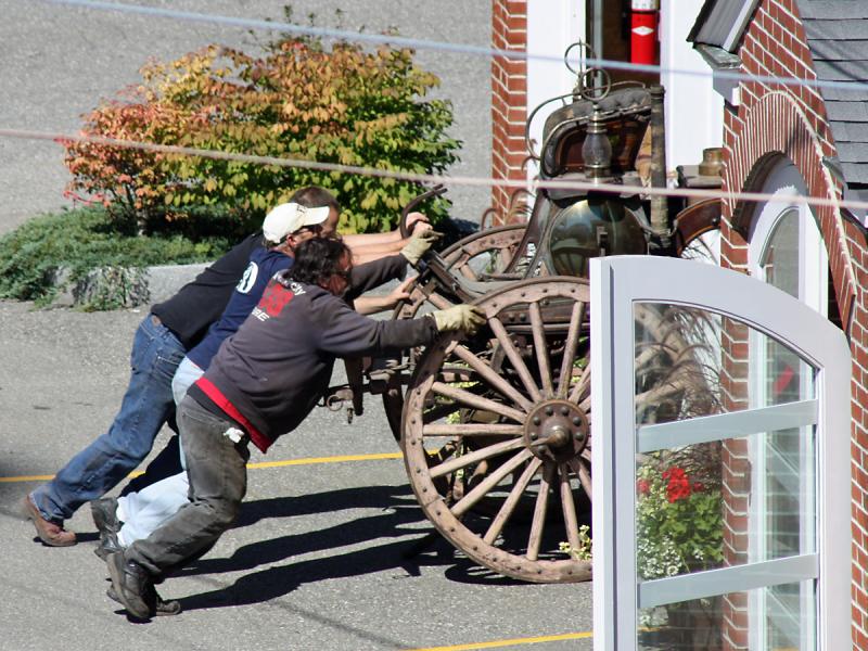A little more muscle is needed to get Camden's antique steam fire pumper inside the fire station, where some preservation work soon got underway Tuesday.
