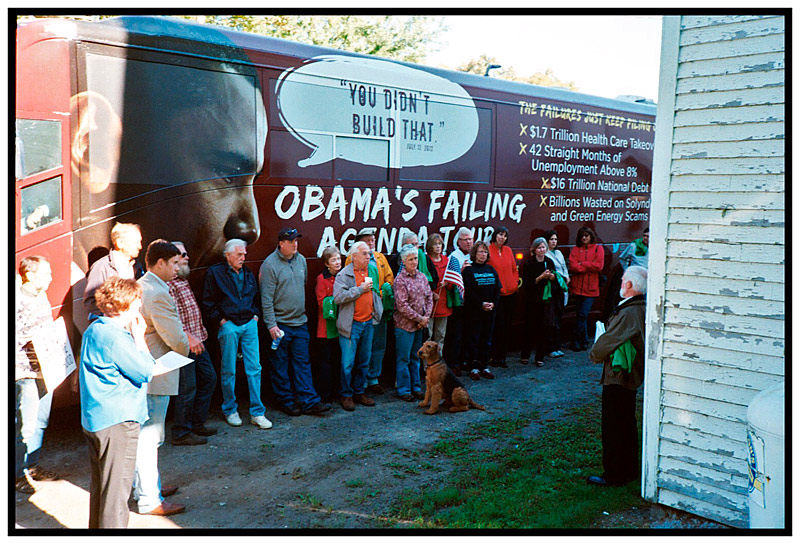 FREEDOM – Residents of Freedom and nearby towns listen to activist Dan Remian during a rally by Americans for Prosperity in front of the Dirigo Grange. The conservative political advocacy group brought its East Coast tour bus through Maine last week.