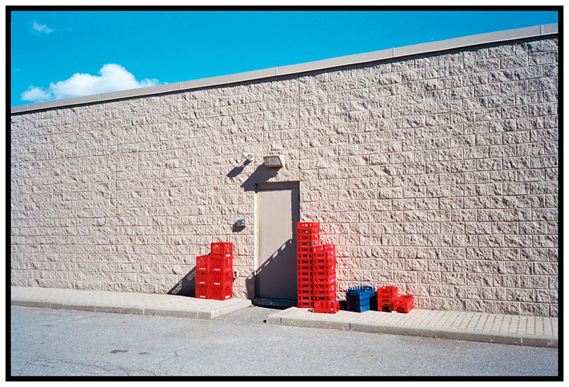 BELFAST – Milk crates, gas station back door.