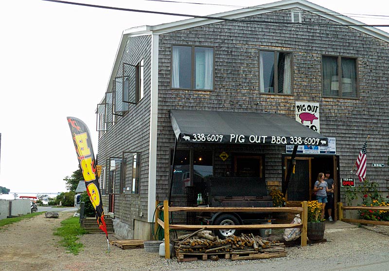 The relatively hidden location of Pig Out BBQ on Marshall Wharf may see a lot more foot traffic with the construction of the Belfast Harbor Walk, slated to follow the dirt path visible to the left of the restaurant. (Photo by Ethan Andrews)