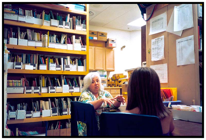 BELFAST – Librarian Sea Chauvin talks with a student in a the storage room of the Captain Albert Stevens School library during a schoolwide lockout, called after an unknown truck appeared twice outside the school. It was the first such incident of the year.