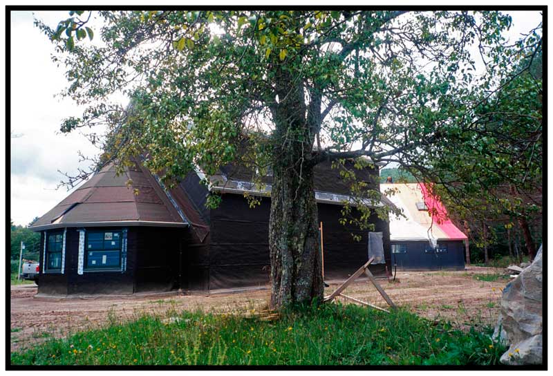 HOPE – Sweetland Center under construction, seen from behind one of the pear tree namesakes of Sweet Tree Arts, the community arts organization that plans to call the building home.