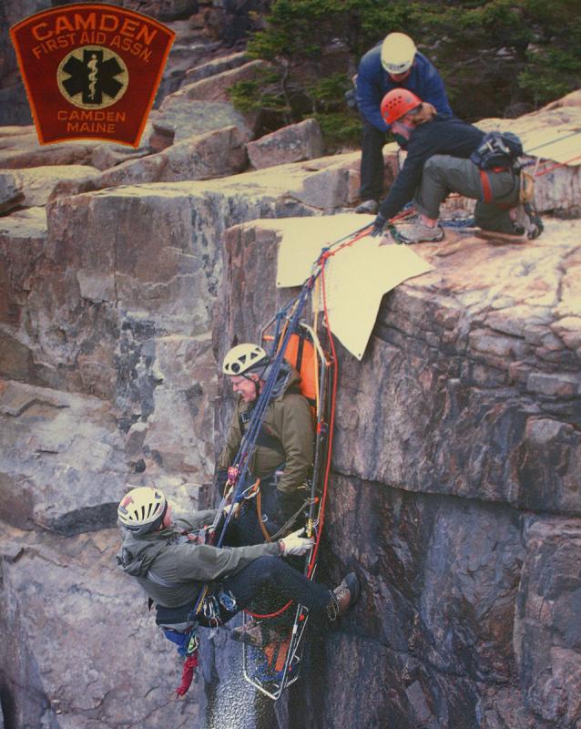 When packaged correctly, a patient can be lowered vertically down a mountain, like instructor Bill Bentley demonstrates in this training photo. (Photo by Holly S. Edwards)