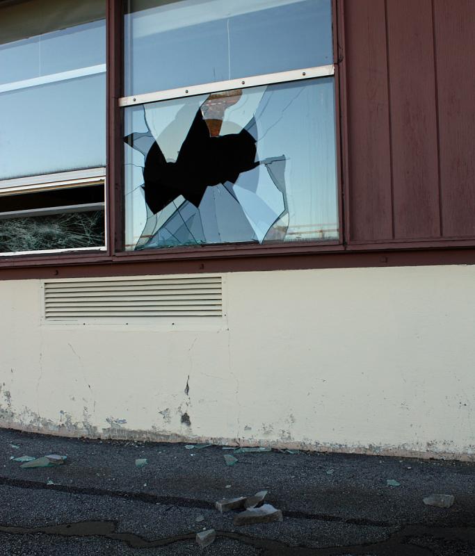 A busted window on the backside of MacDougal School. (Photo by Holly S. Edwards)