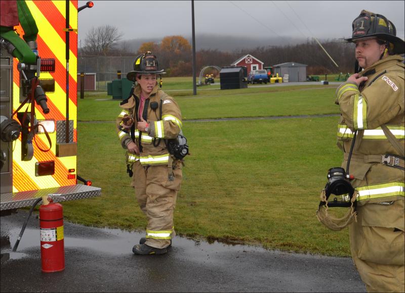 Rockland firefighters Katie Vanorse and Rusty Barnard inspect the jail for the source of smoke in the booking area. (Photo by Lynda Clancy)