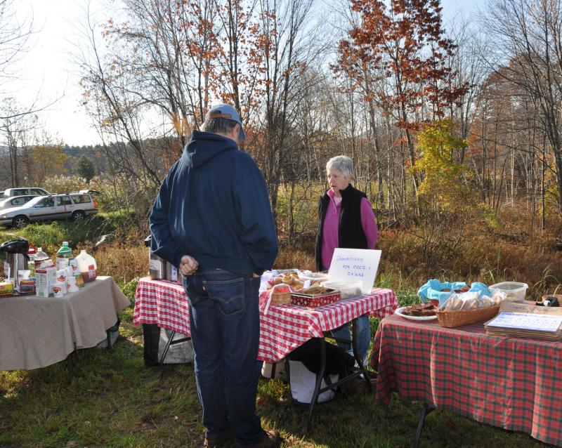 Roberta Heald works the bake sale table, raising funds for the ongoing Center School relocation and renovation project. (Photo courtesy Barbara Hatch)