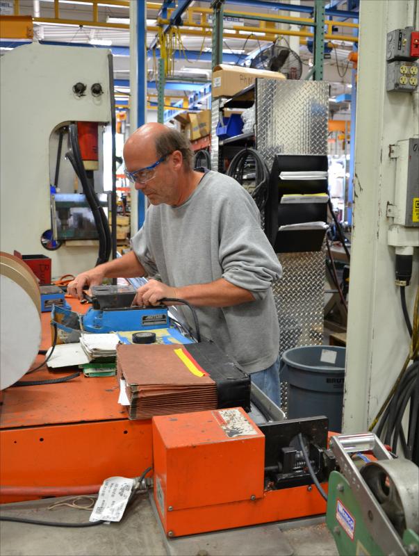 Jim Kauth, of Appleton, Wis., assembles cables for battery chargers for the firetrucks. They are all custom-wired, and he works on one project at a time. He has worked at the Pierce plant since 1999. When he goes on vacation he spends his time volunteering for the Salvation Army. (Photo by Lynda Clancy)