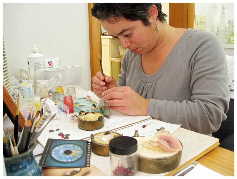 Jolene Bryant of Knox paints sclerae (whites) and irises for prosthetic eyes. (Photo by Ethan Andrews)