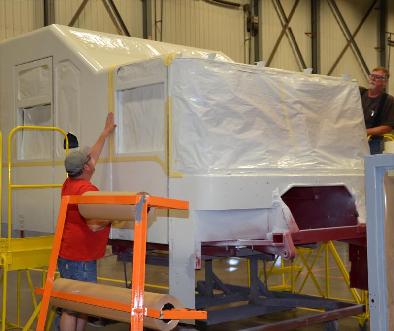 Ross Vaughn Koziol readies a cab for a paint job. (Photo by Lynda Clancy)