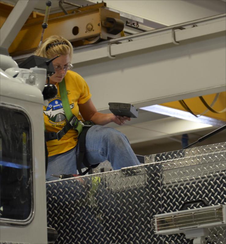 Sarah Luedtke works on assembling a truck. (Photo by Lynda Clancy)