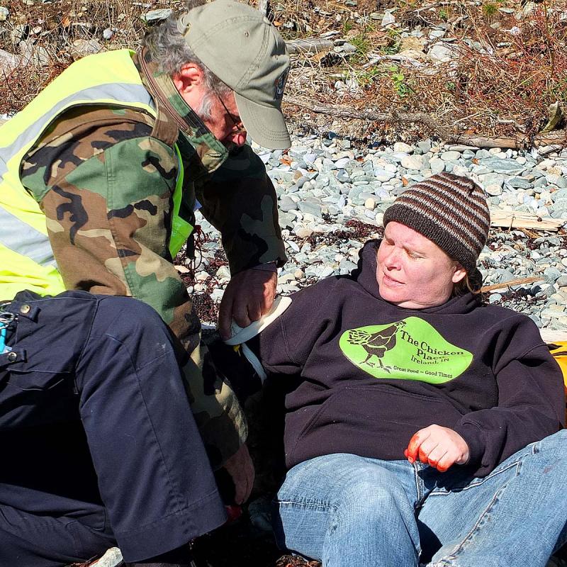 A 'victim' suffering an amputated hand gets a tourniquet during Saturday's mass casualty drill. (Photo by Holly S. Edwards)
