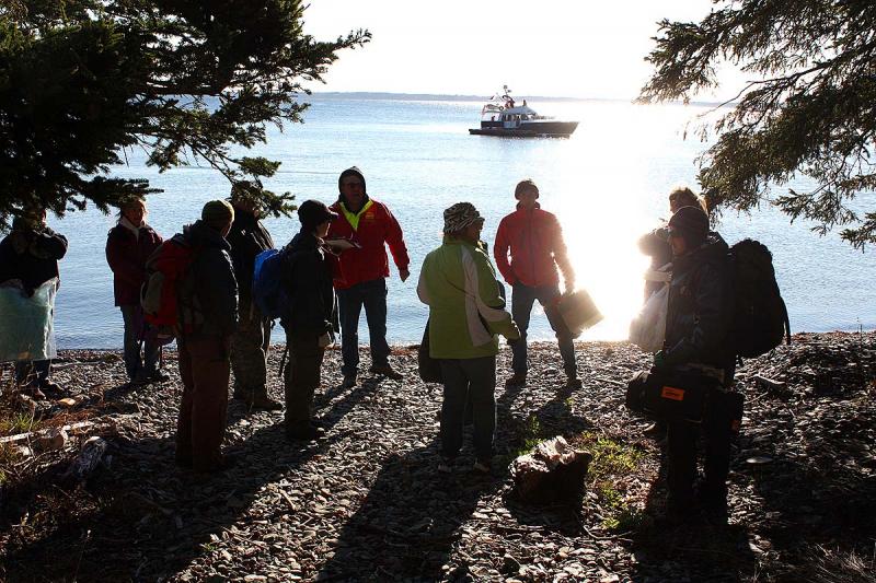 Saturday's volunteer victims receive a briefing on what to say and how to act when search and rescue crews pariticipating in the mass casualty exercise find them later in the morning. (Photo by Holly S. Edwards)