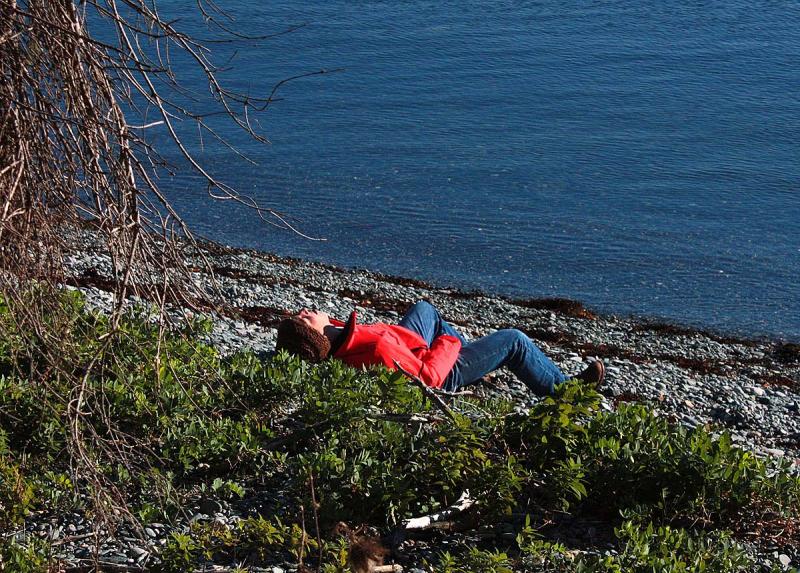 A volunteer victim of a hypothetical plane crash soaks up the sun, while looking a bit distressed for the camera. (Photo by Holly S. Edwards)