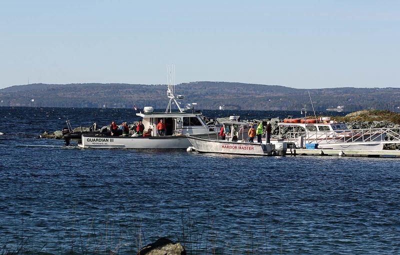 The search and rescue crews arrive on Lasell Island Saturday morning. (Photo by Holly S. Edwards)